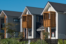 A row of two storey townhouses on a residential street